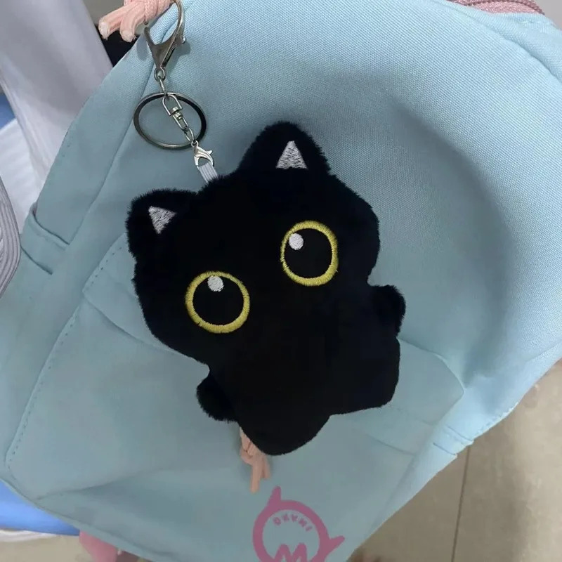Cute plush toy of a black cat, - Photography Rules ulasan dan harga